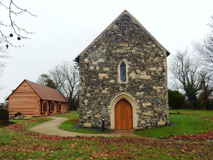 View of the restored chancel building and the new hub/studios in the background